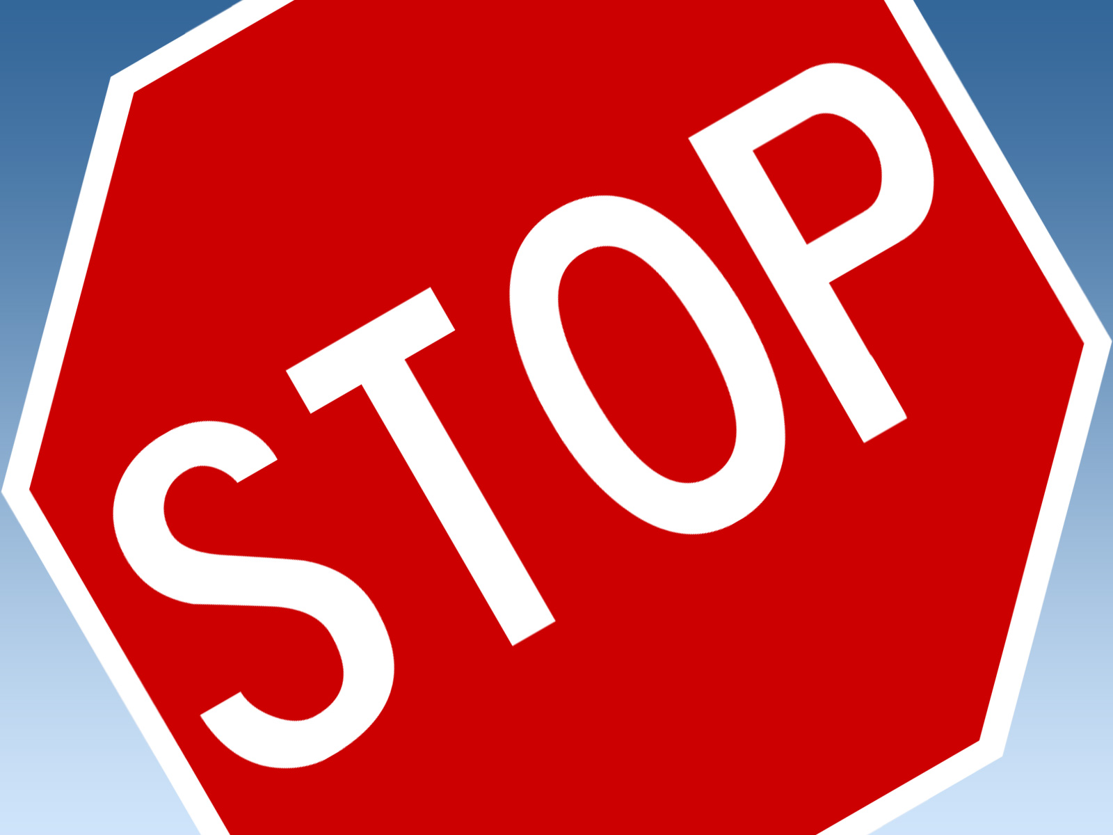 Stop sign with slanted writing