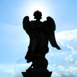 Angel statue silhouette along Sant'Angelo bridge in Rome
