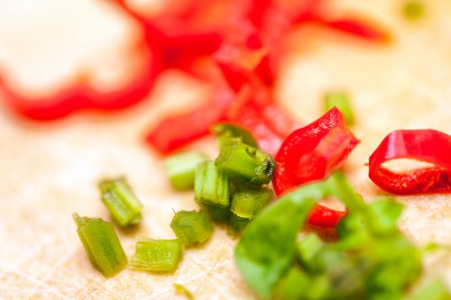 Sliced red and green vegetables