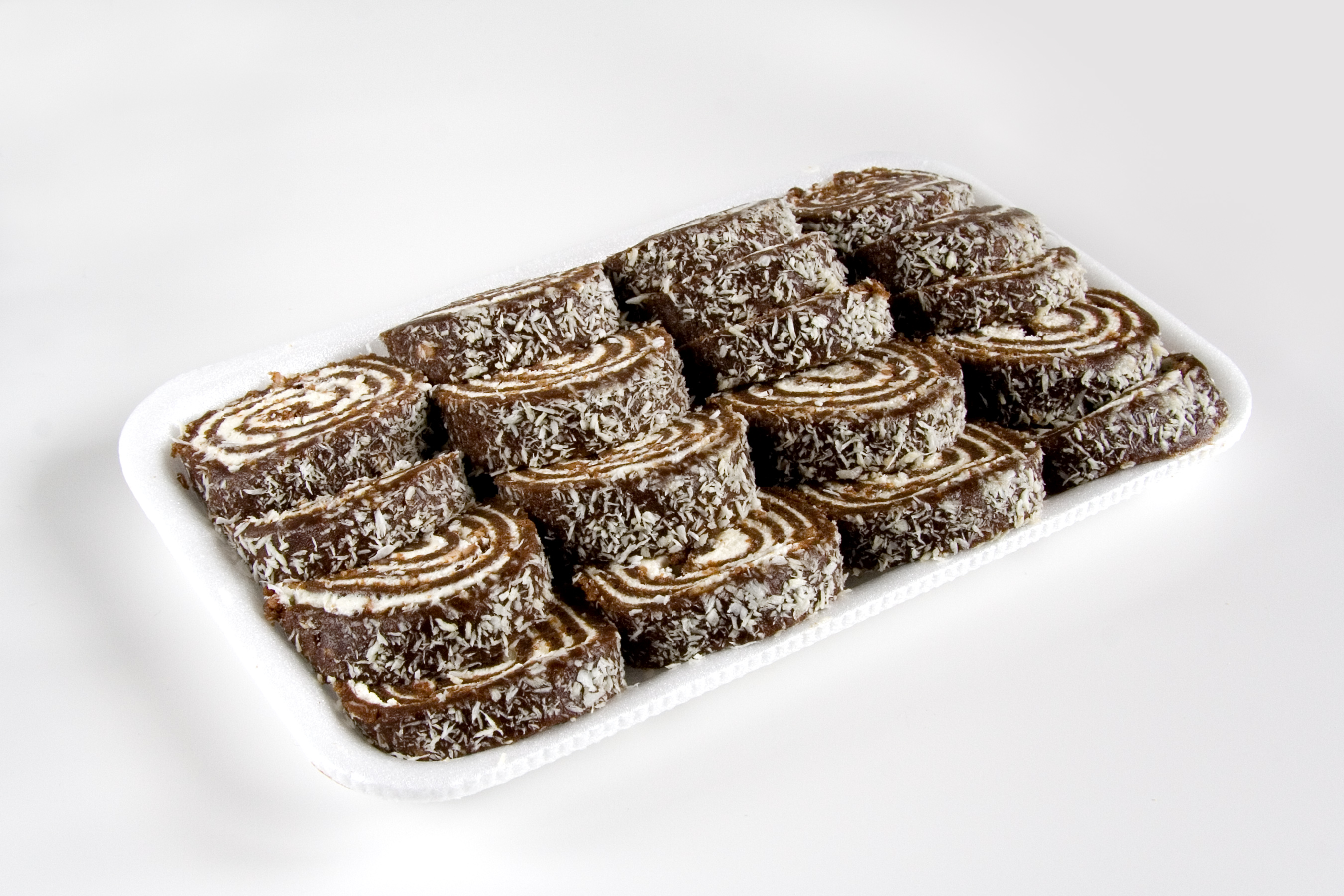 Chocolate rolls with coconut flakes