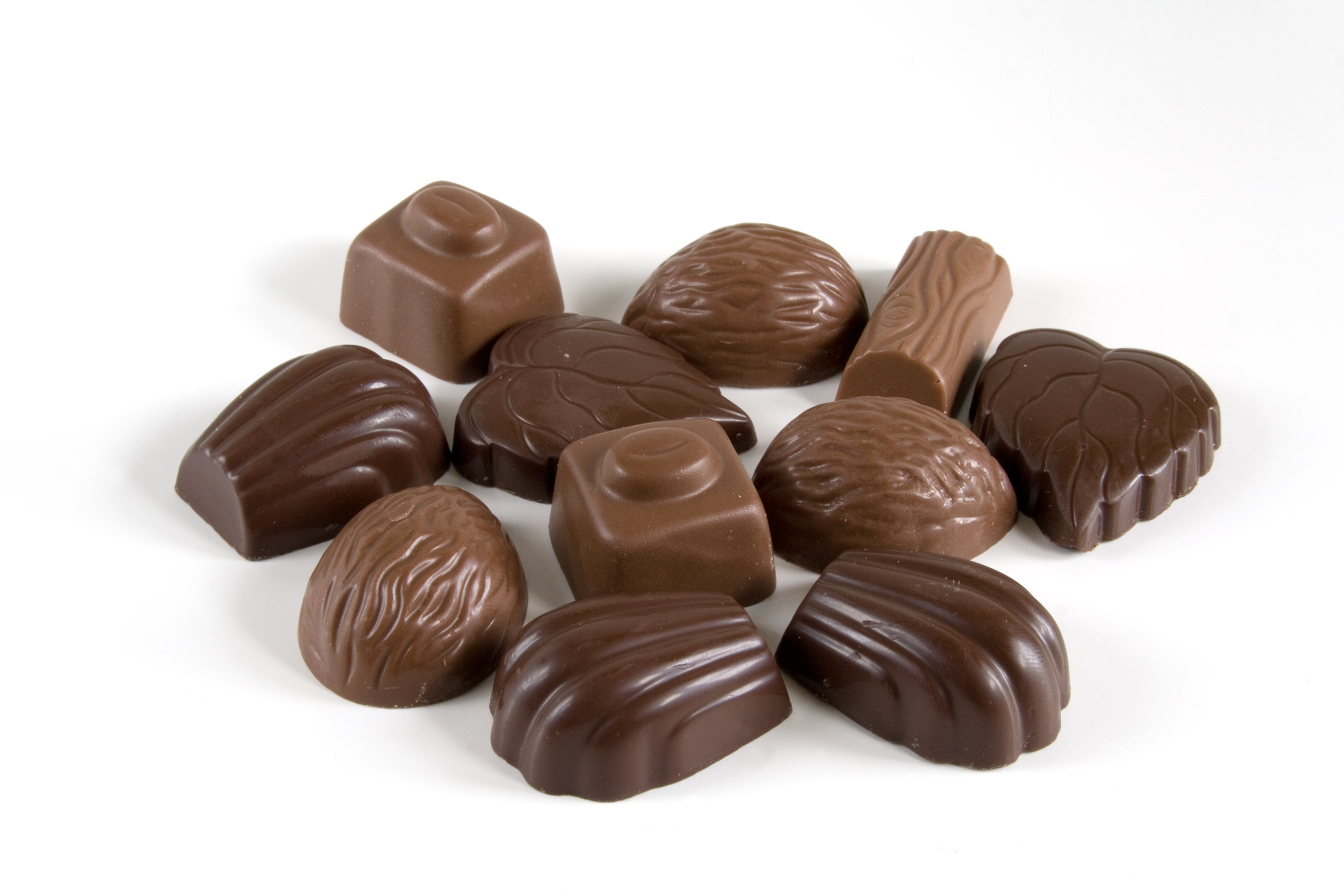 Various chocolates on white background