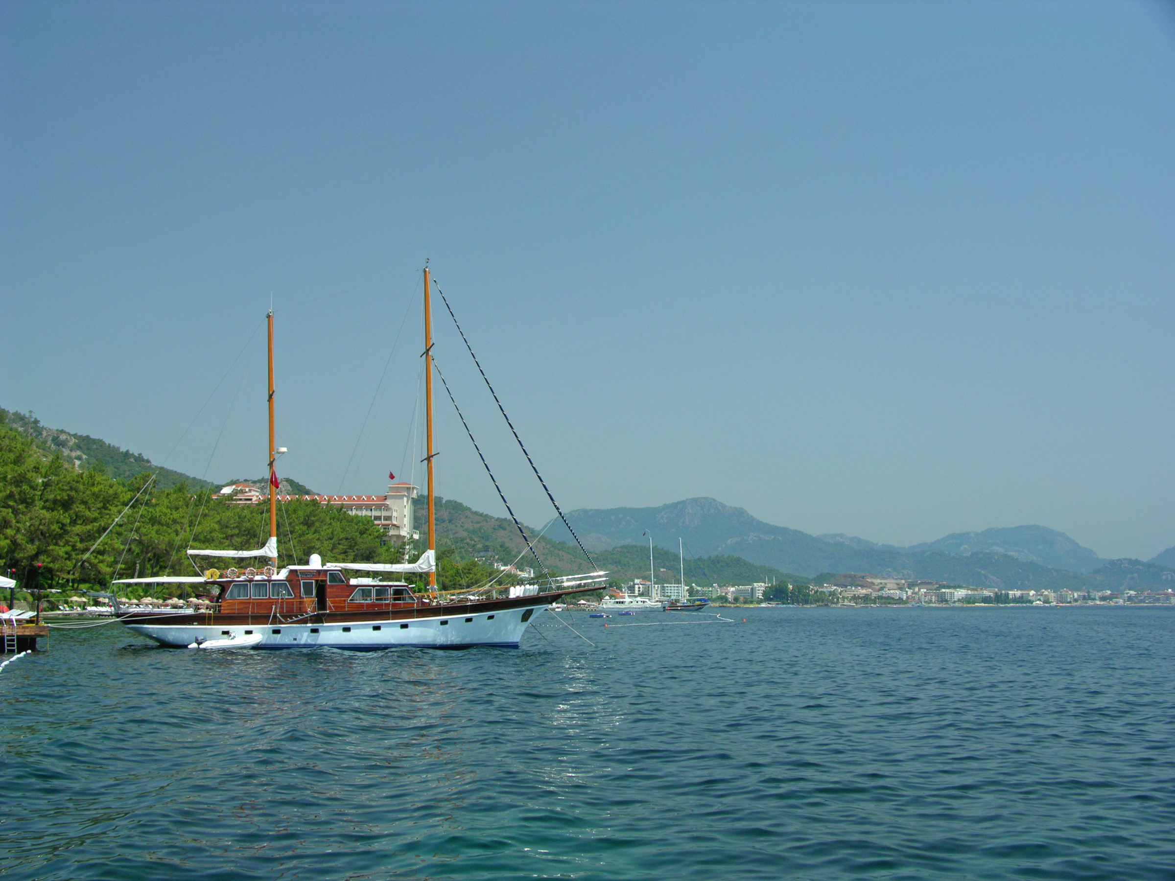 Sailboat moored by a tourist resort in Marmaris