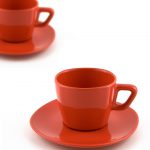 Two red coffee cups on white background