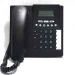 Black corded phone on white