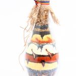 Multicolored layered seeds in a bottle