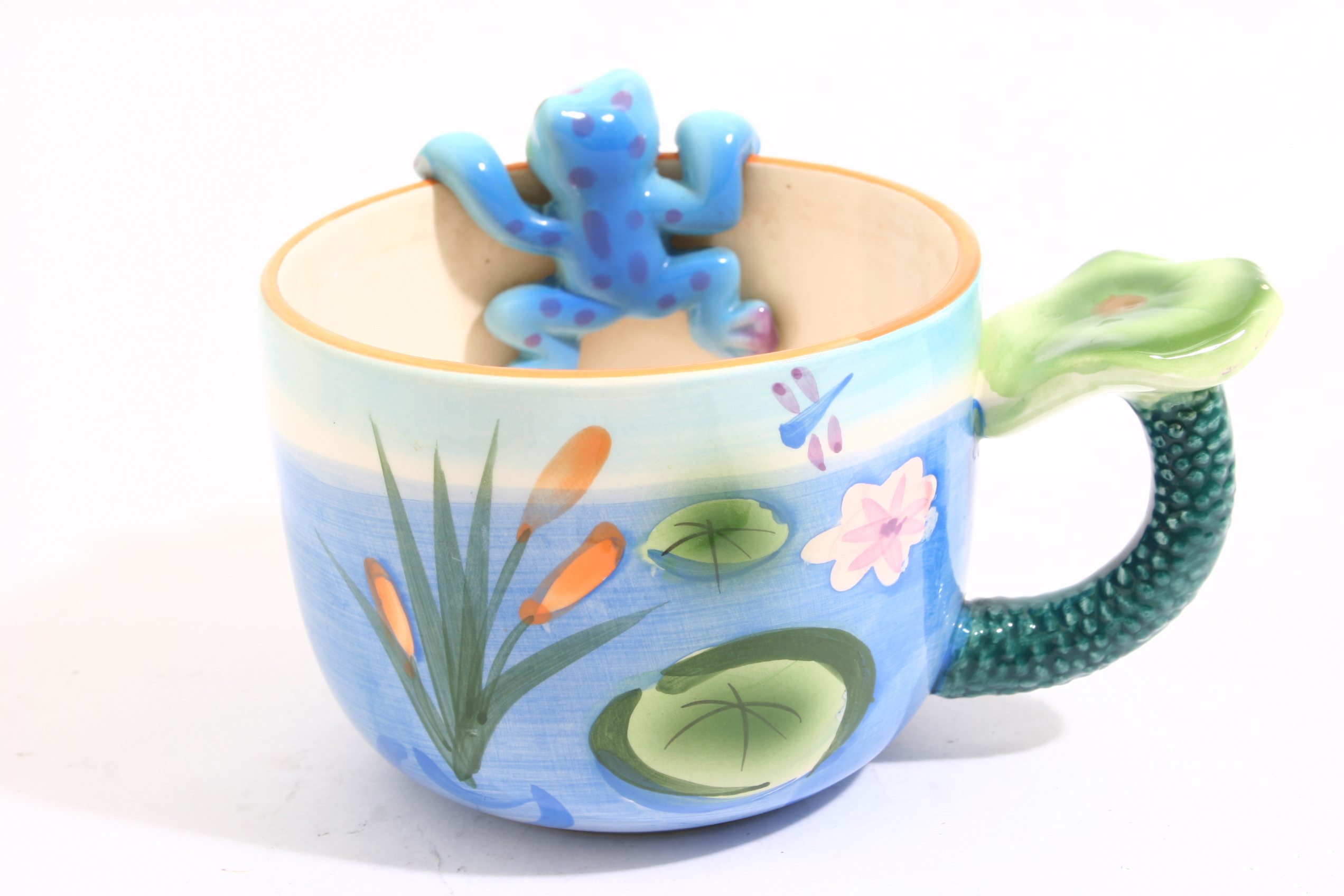 Funny cup depicting a lake and a frog