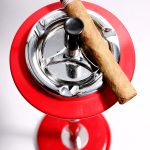 Red ashtray and cigar