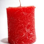 Red candle isolated on white