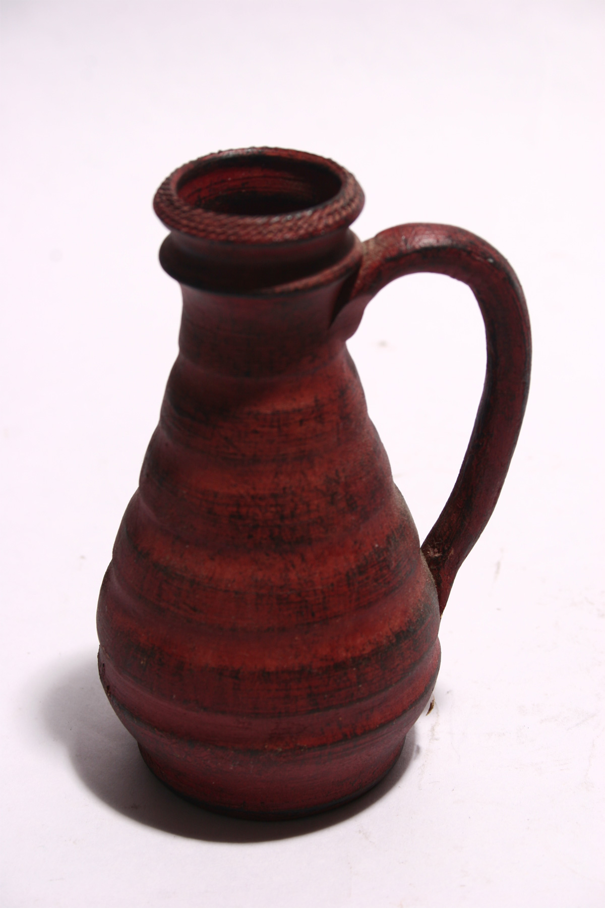 Ceramic jug on white