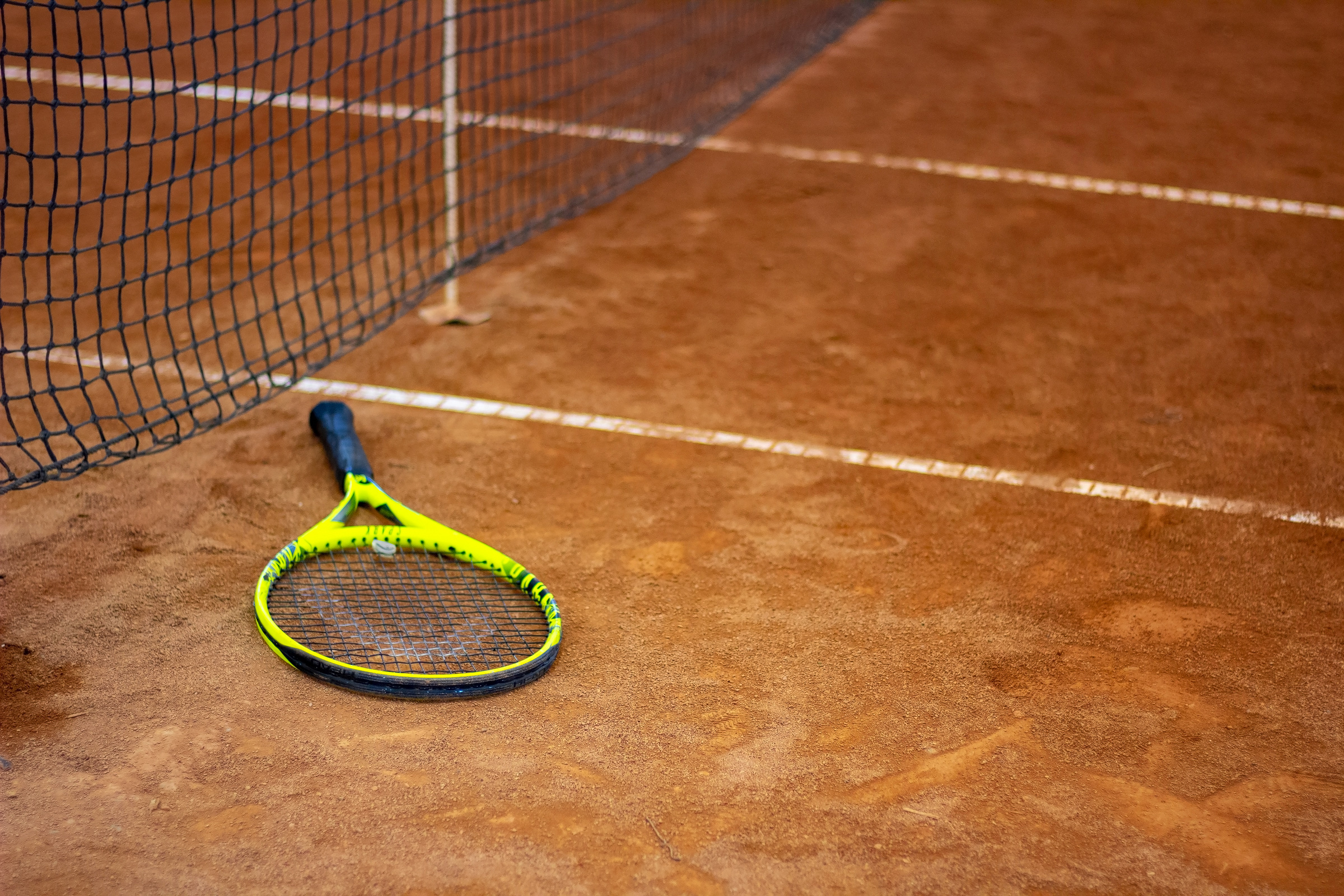 Tennis racket on a tennis court