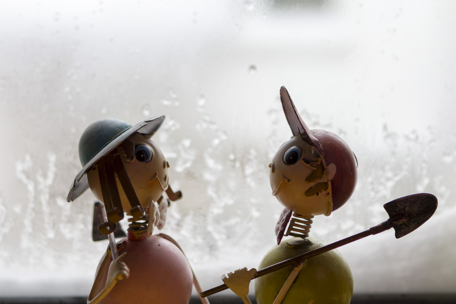 Tin figures in the window