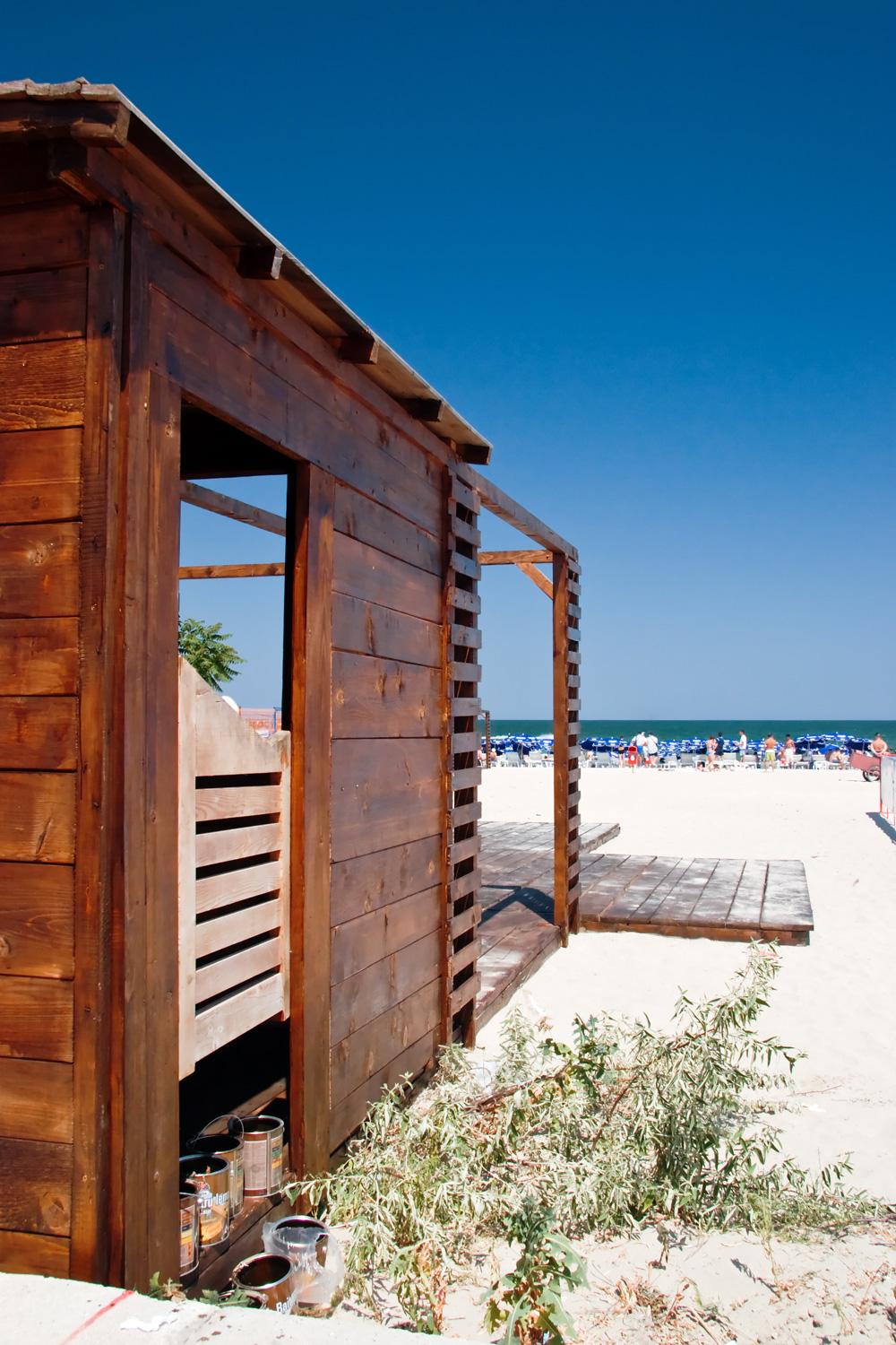 Wooden shed under construction on the beach