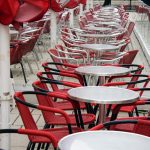 Street cafe with red chairs